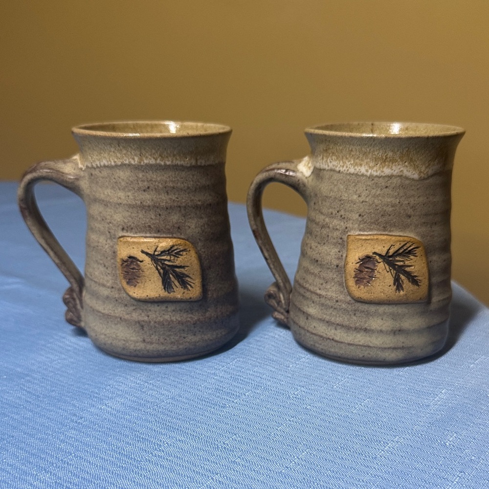 Sold
Studio Pottery Brown Mugs with Pinecone Design signed Kathy Smith